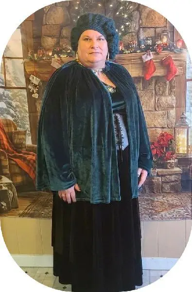 Handmade Artisan Regina L. wearing some of her handmade items. BBW , mature woman. Renfair clothing. Crochet hat. Handsewn cape. Hanmade Jewelry