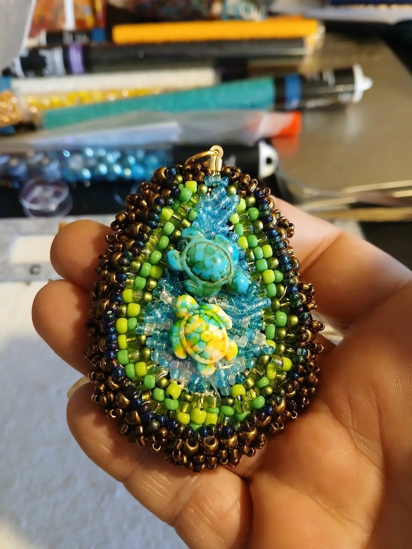Hand-beaded Turtle themed pendant for sale by Artisan Regina L. A perfect gift idea for those who love a wearable art accessory with a story and soul
