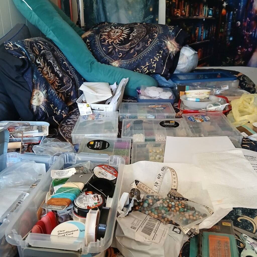 ARtisan Regina L from ReginaCreates(tm) bed doubling as the material stash zone inside her bedroom while working on some of her handmade creations. Unfiltered creation process station number 1